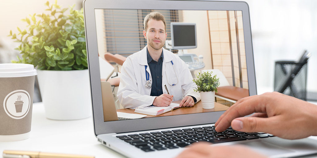 doctor on laptop providing telemedicine services